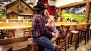 Full-bosomed brunette is having sex next to the Christmas tree