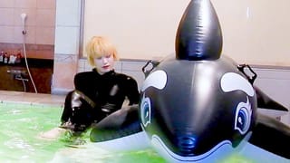 PU Suit in the Pool – Dolphin Ride Gets Wet and Glossy
