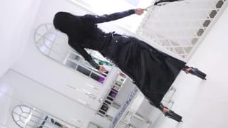 Mistress Kennya in Black Latex with Whip