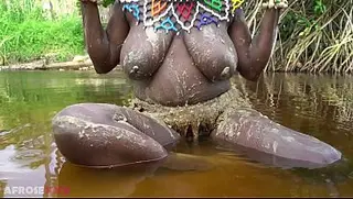 Water porn video – Busty African girlfriend teasing naked in a river outdoor